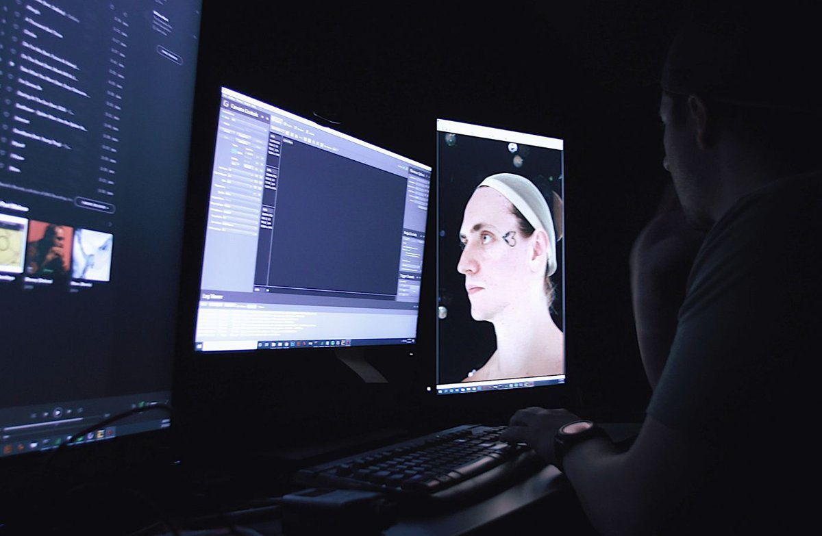 Man Infront of a computer doing some editing